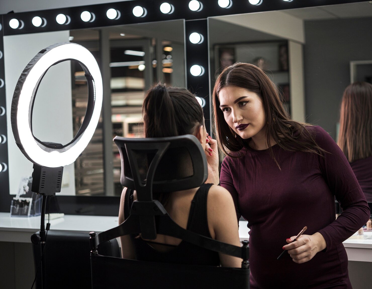 make-up-artist-applying-make-up_23-2148328770